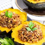 2 acorn squash halves stuffed with wild rice