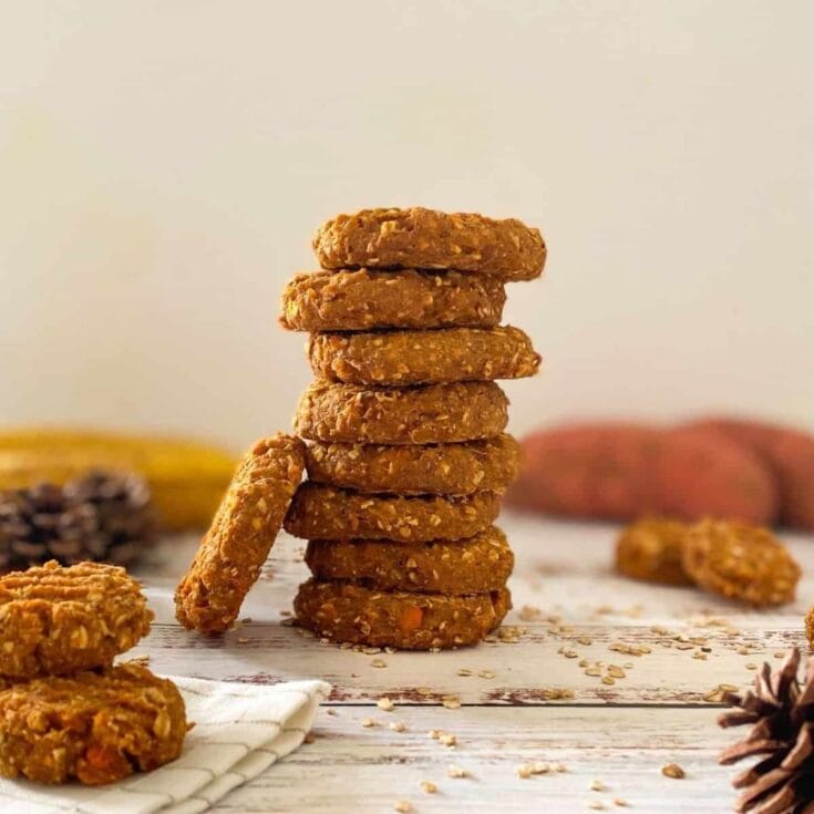 vegan sweet potato cookies stacked on white table