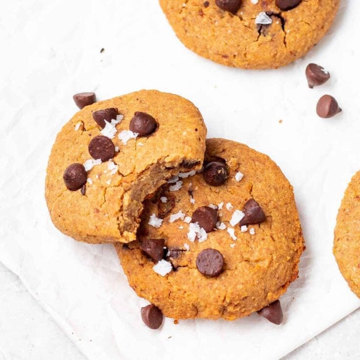 vegan chocolate chip cookies with a bite out