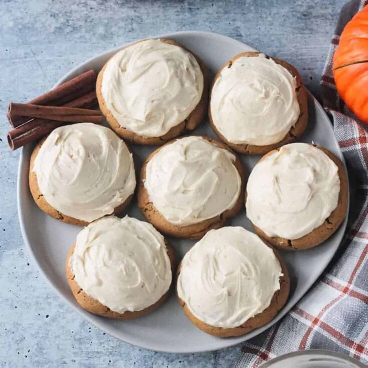 iced vegan pumpkin cookies on plate
