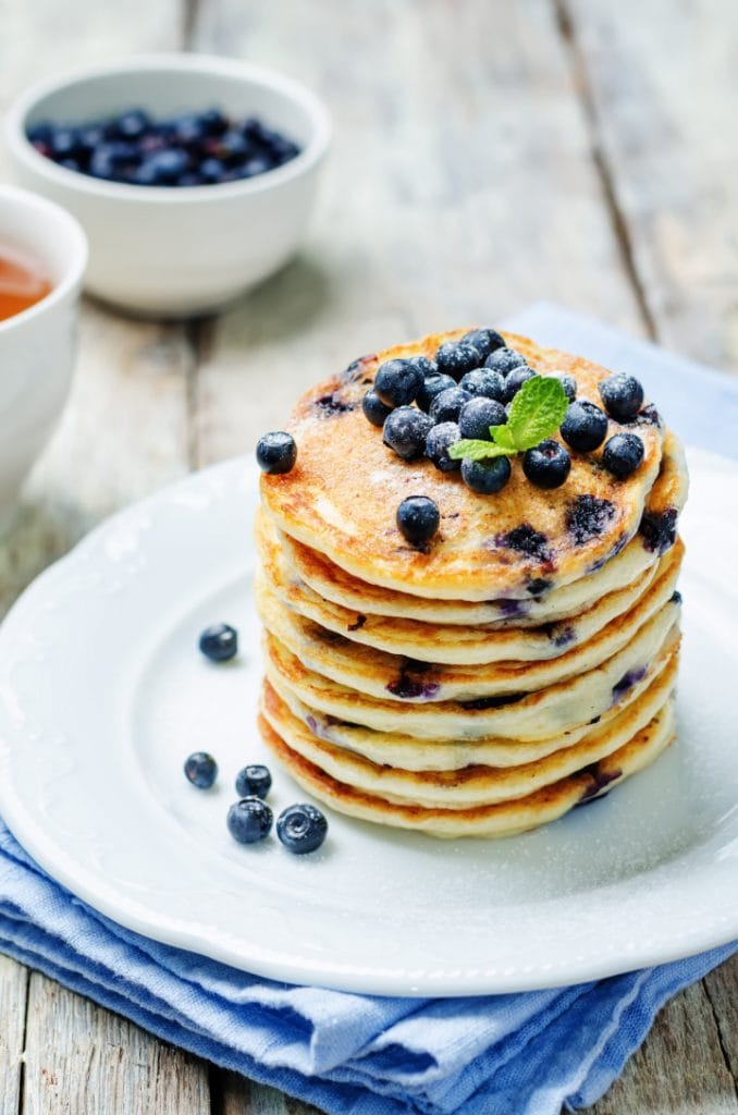 blueberry pancakes on white plate