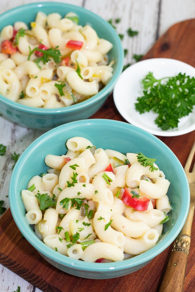blue small bowls filled with macaroni salad