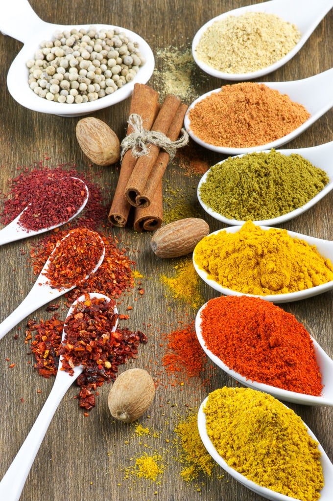 Close-up of assorted spices on wood.