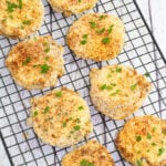 cooked air fried green tomatoes on black cooling rack