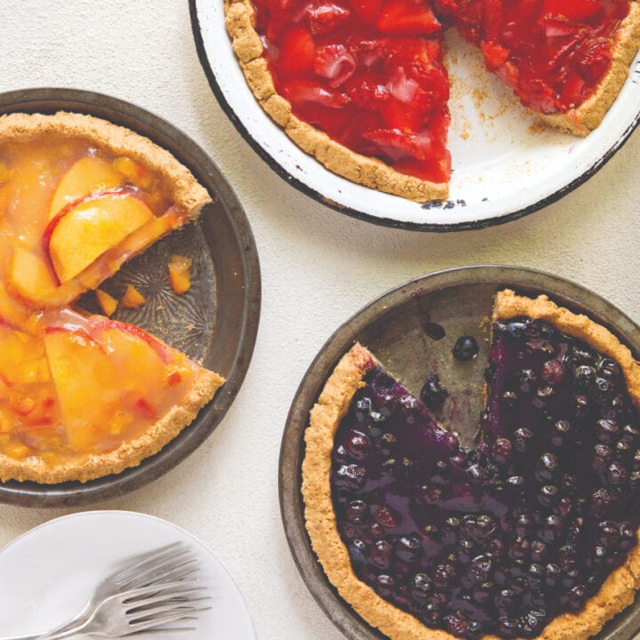 3 fruit pies, blueberry, strawberry, peach