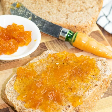 slice of whole wheat bread topped with jelly