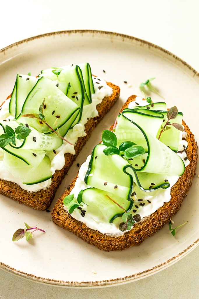 vegan cucumber sandwich on white plate