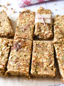 gluten-free granola bars sliced and on white parchment paper