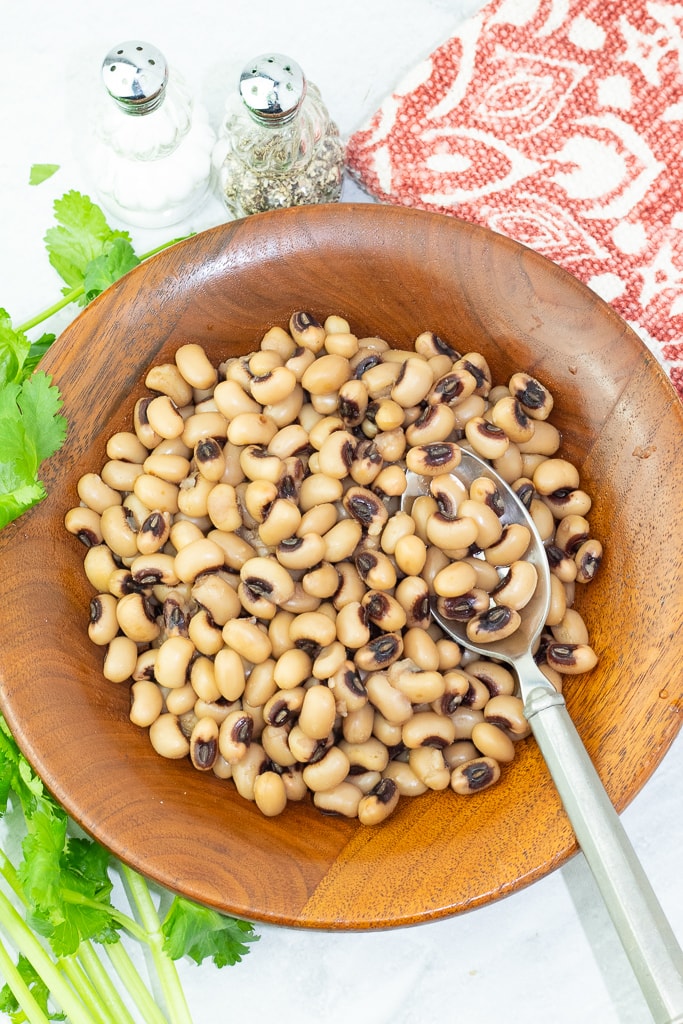 wooden bowl with cooked black eyed peas