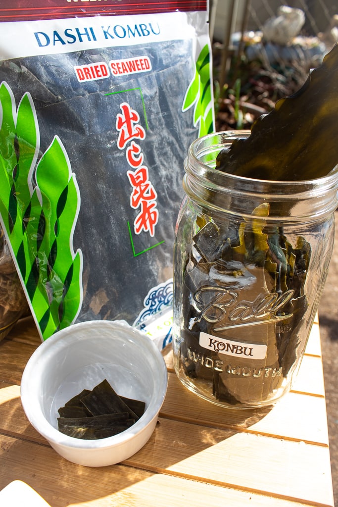 kombu seaweed in package, jar, and small white dish to display what it looks like