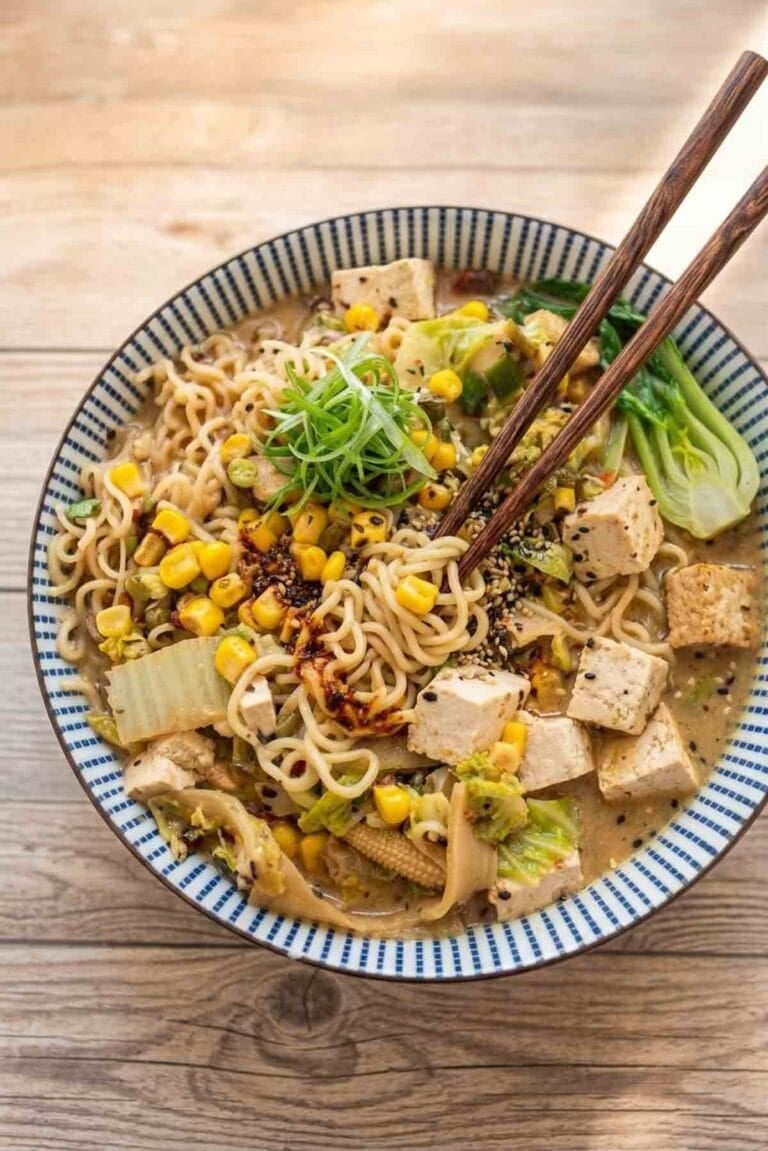 miso ramen with tofu and vegetables in a colorful bowl with chopsticks.