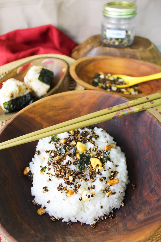 wooden bowl with rice and furikake with chopsticks