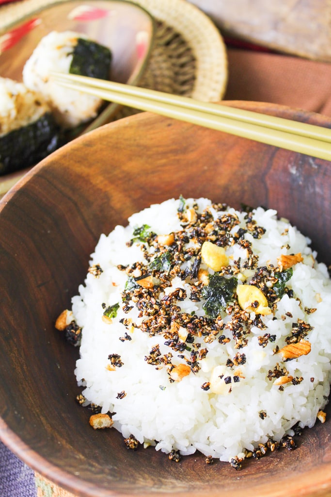 asian wooden bowl filled with rice and homemade furikake with chopsticks
