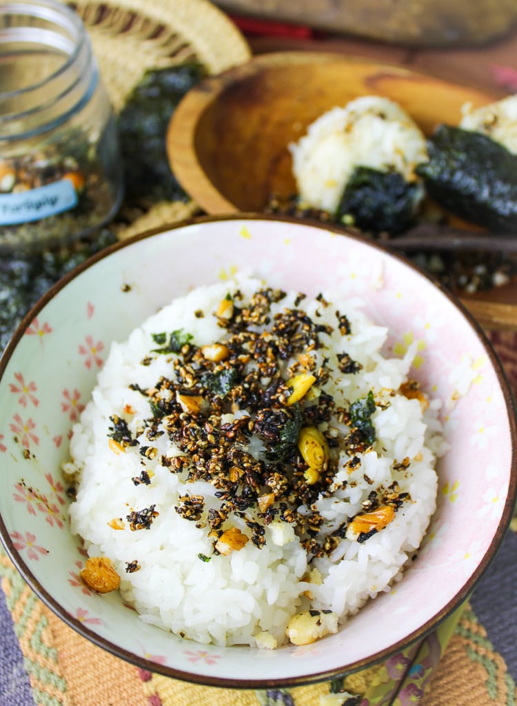 white floral Asian bowl filled with rice and homemade furikake