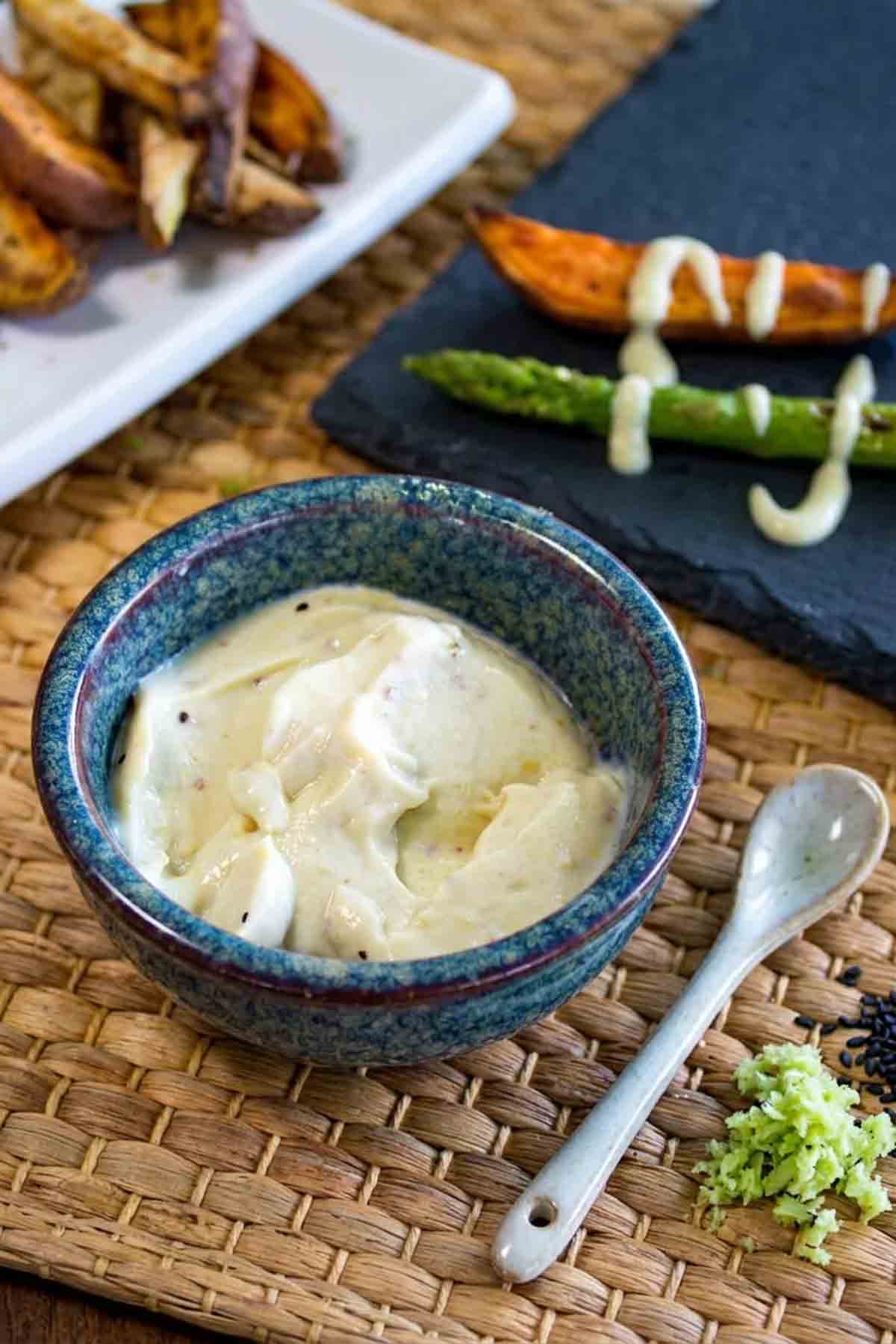 homemade wasabii mayo in a bright blue crock dish.