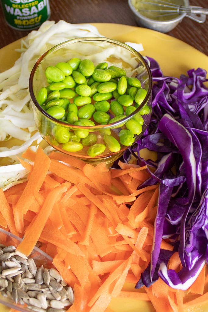 carrots, purple cabbage, onion, and edamame prepped to make asian cabbage salad