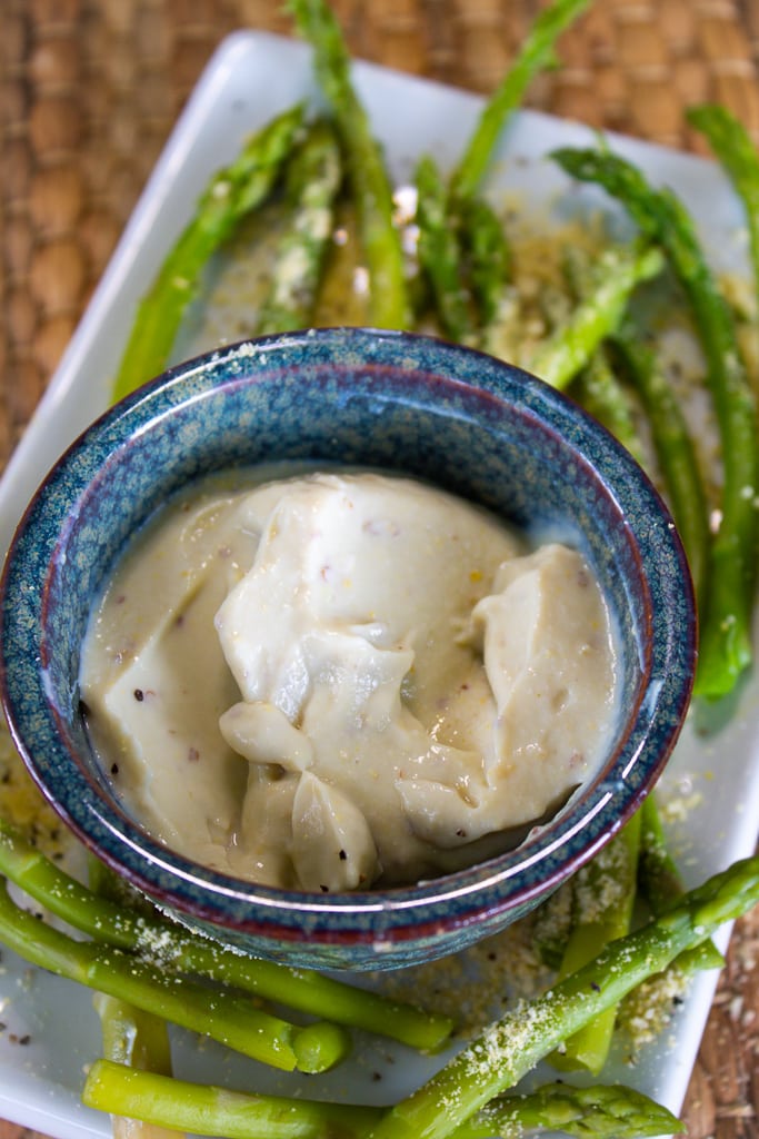 blue bowl on white tray with asparagus and wasabi mayonnaise