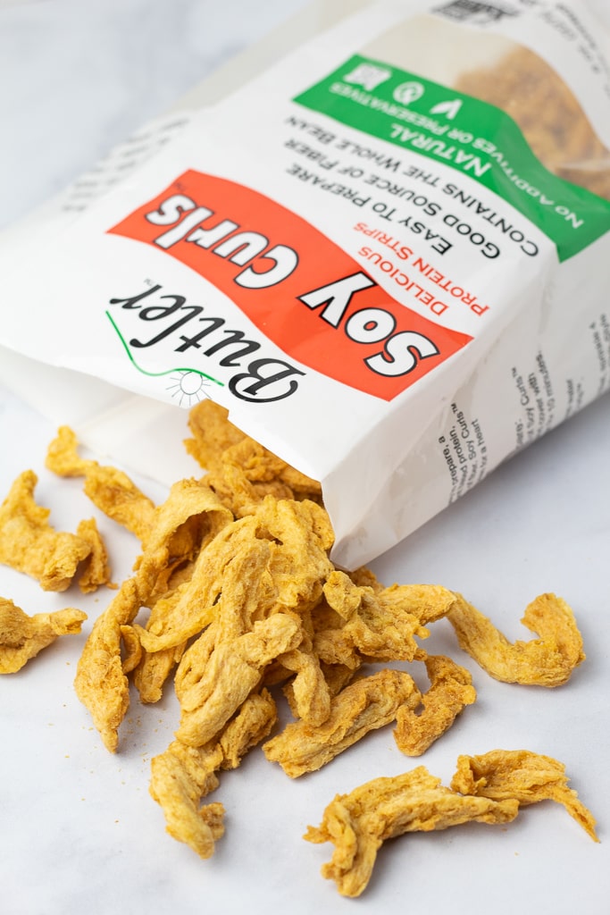 bag of butler soy curls opened and spread out on white countertop