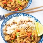 2 bowls of rice and vegan chicken with chopsticks