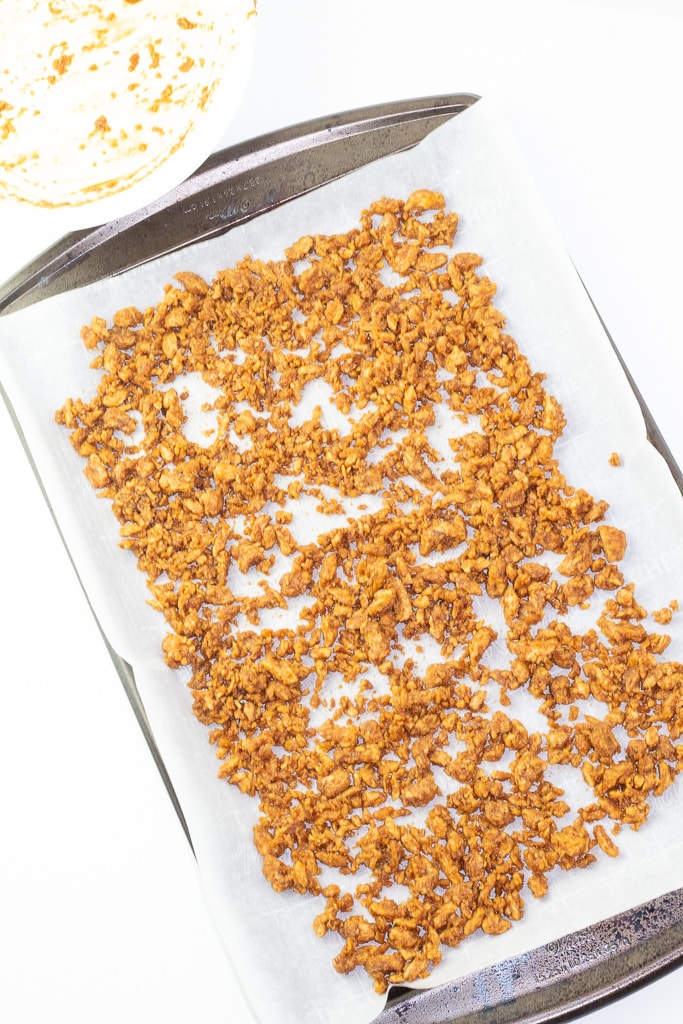 baking sheet lined with parchment paper with soy curl bacon bits