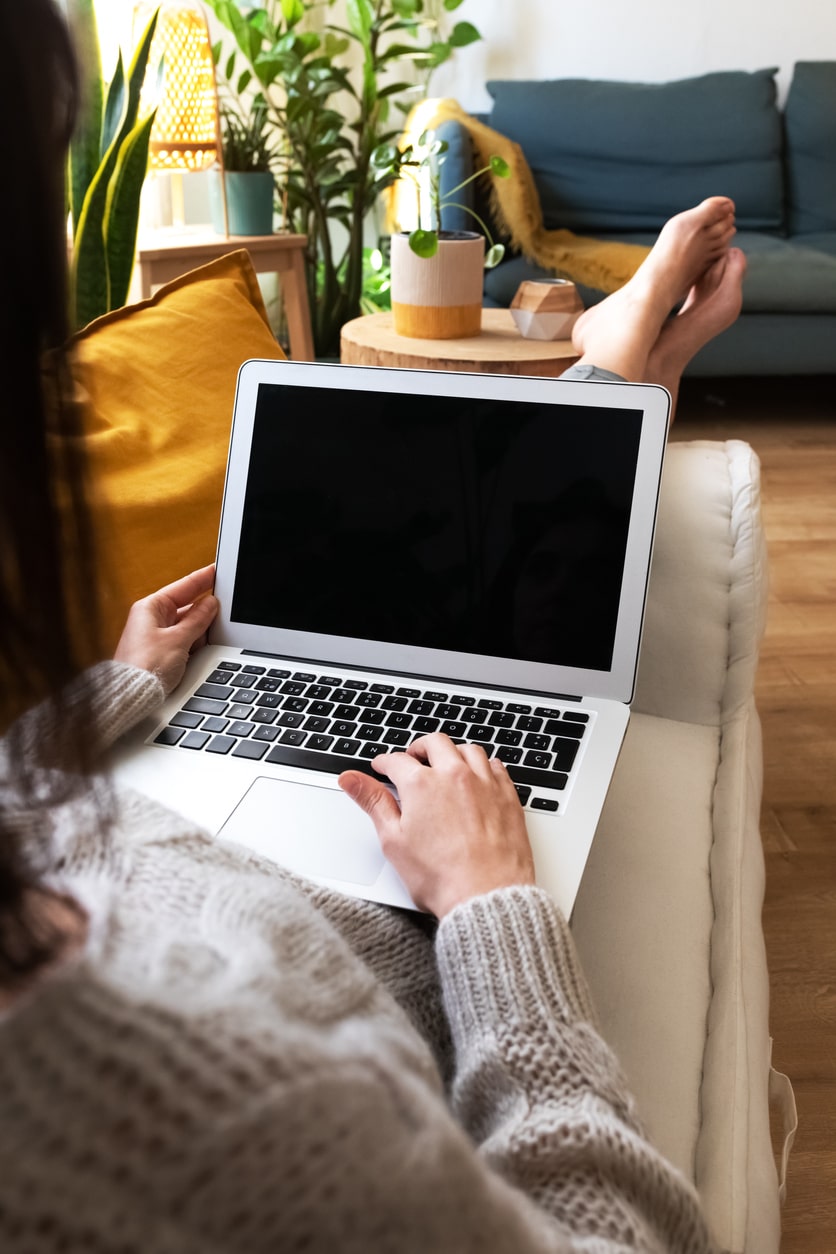 woman holding laptop in lap