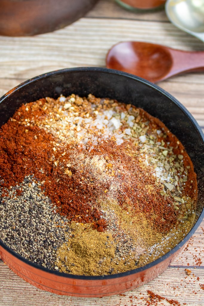 spices mixed in a bowl making mild taco seasoning