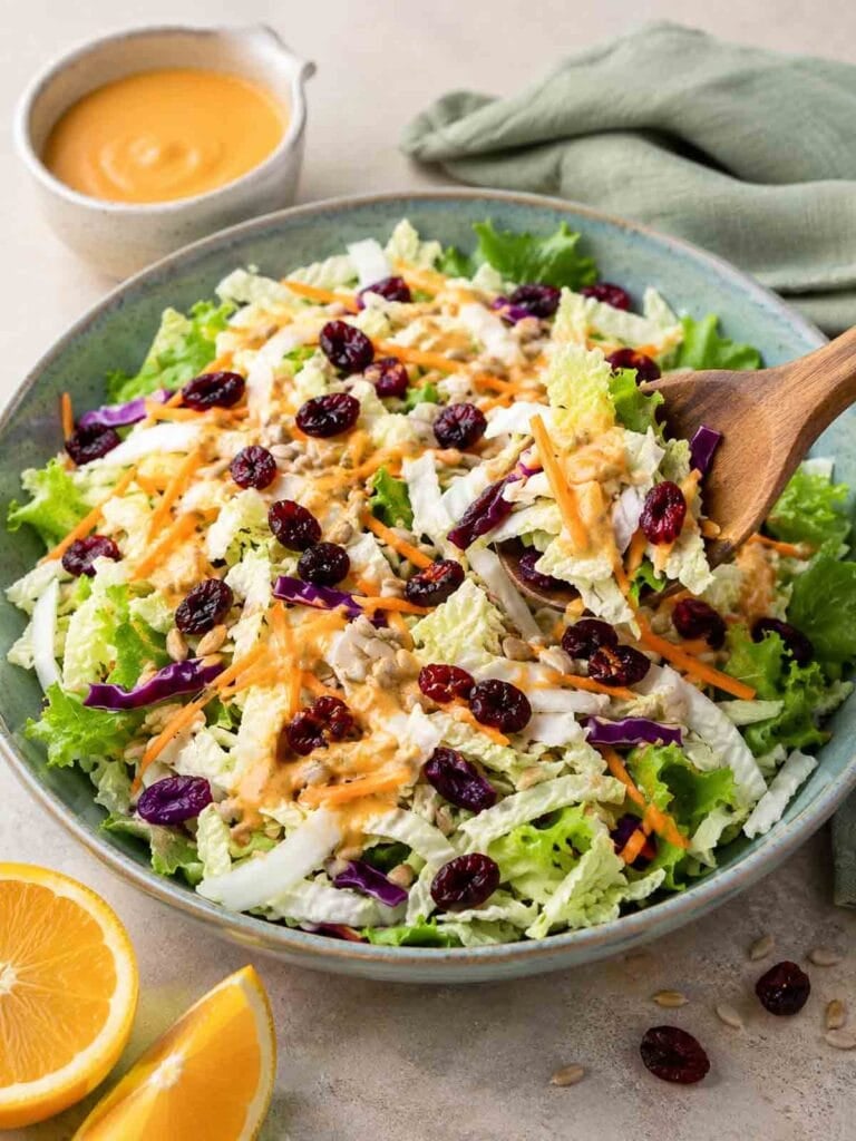 large bowl of napa cabbage salad with miso dressing.