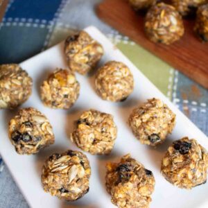 white rectangle platter with oat energy balls lined up on it.