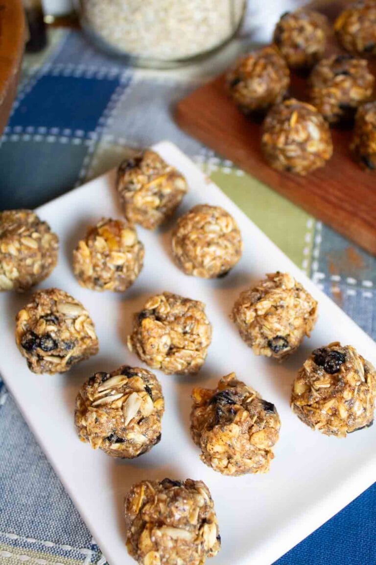 white rectangle platter with oat energy balls lined up on it.