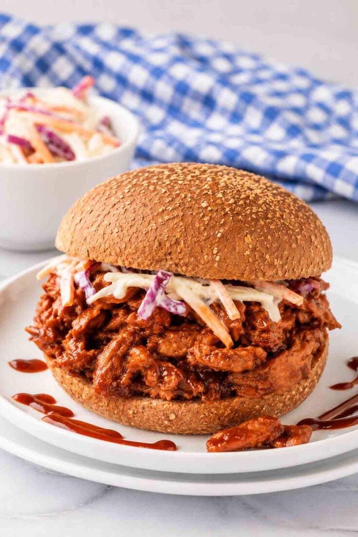 soy curl bbq on a whole-grain bun topped with coleslaw.