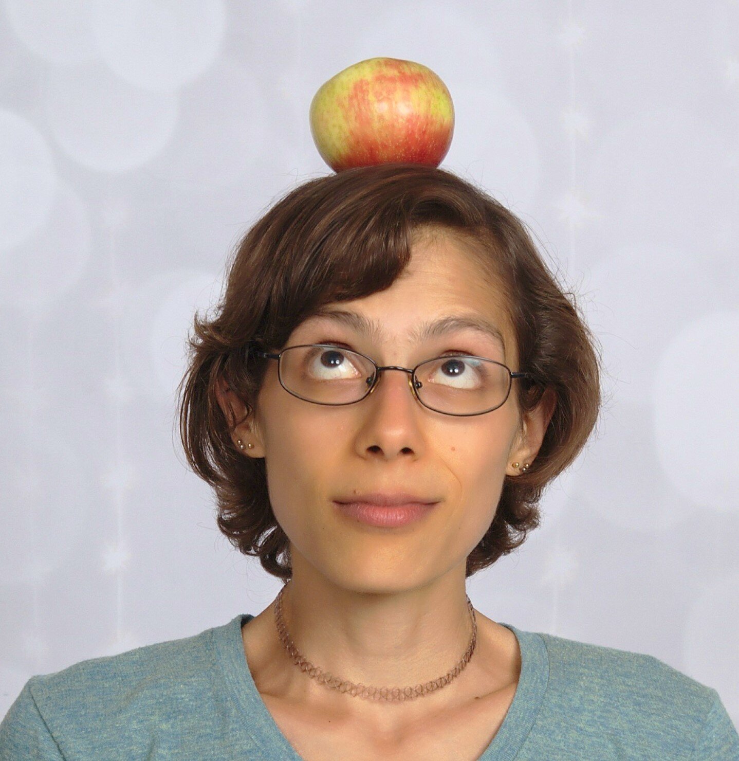 theresa sam houton with an apple on her head.