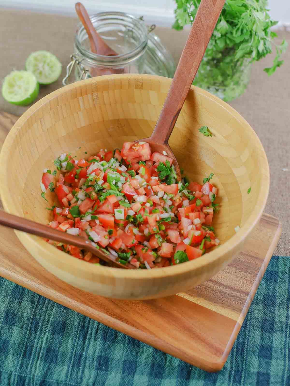 fresh homemade pico de gallo in a mixing bowl ready to serve.