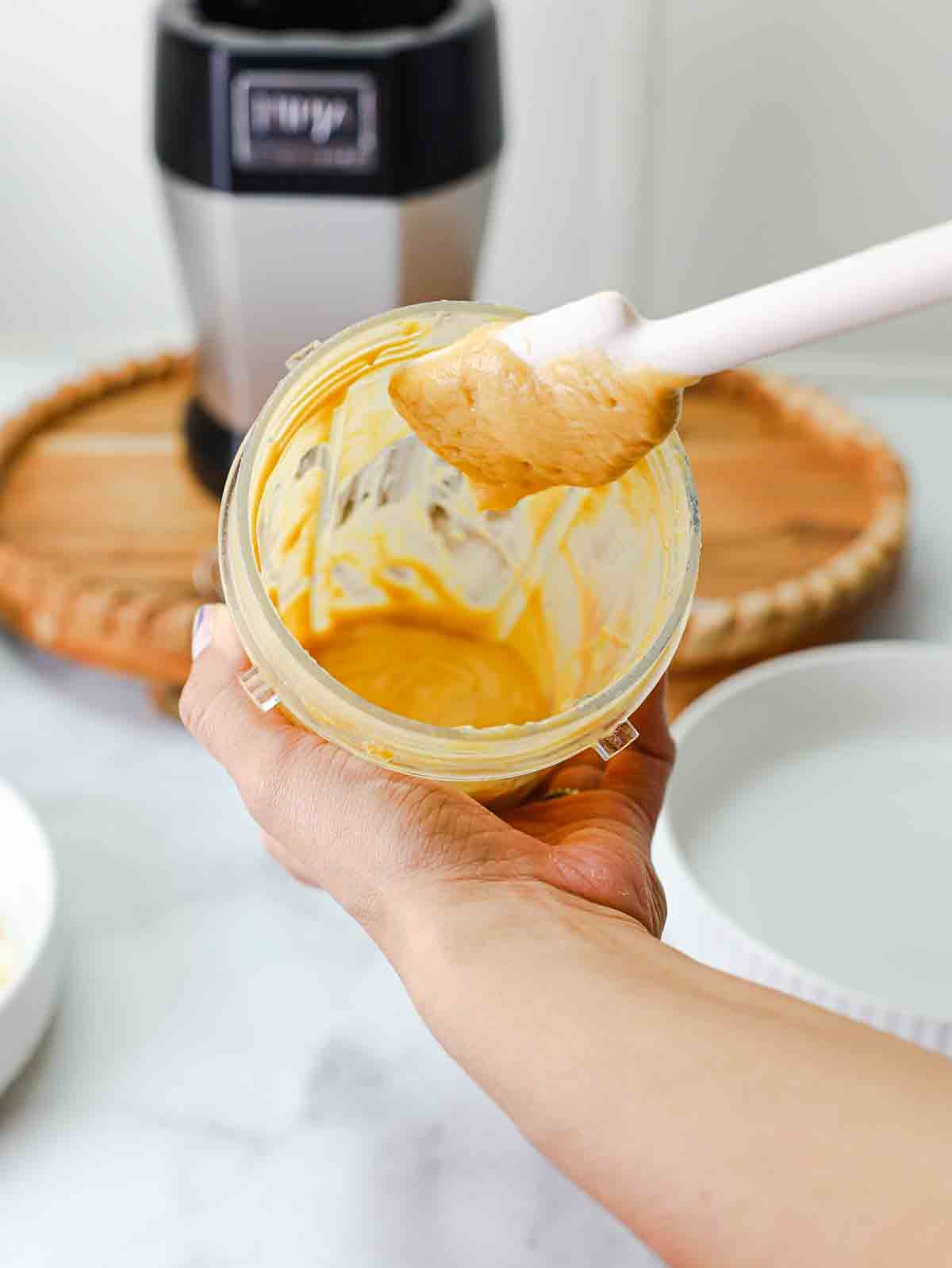 batter for crispy tofu in a blender cup showing the consistency.