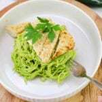 espagueti verde on a white plate topped with crispy panko tofu.