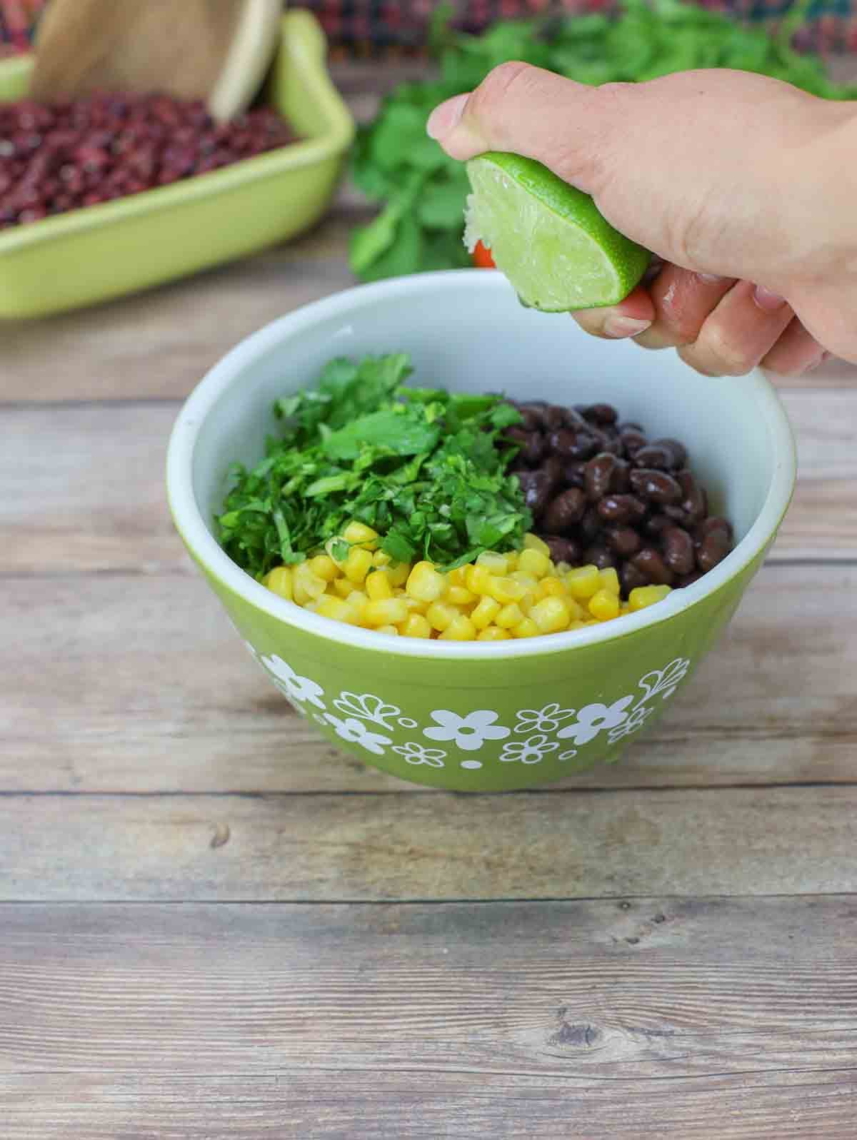 small dish with black beans, corn, cilantro, and lime juice.