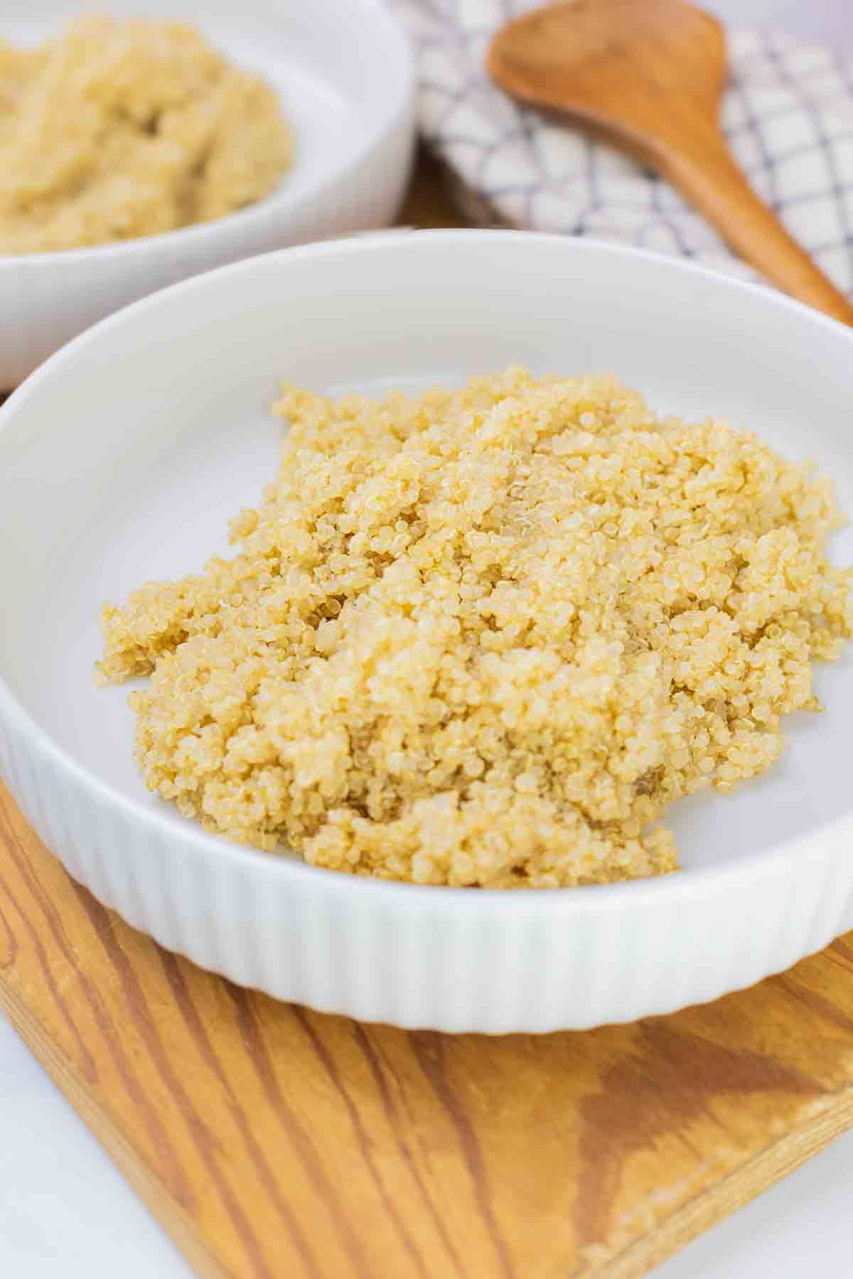 white bowl with cooked quinoa.