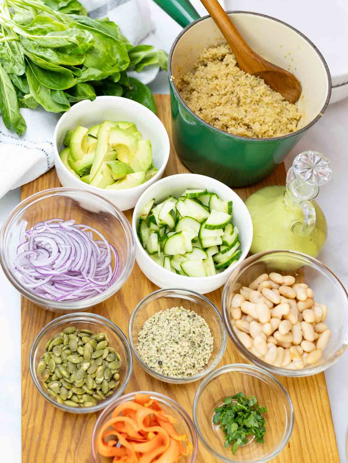 ingredients for a veggie bowl on a cutting board.