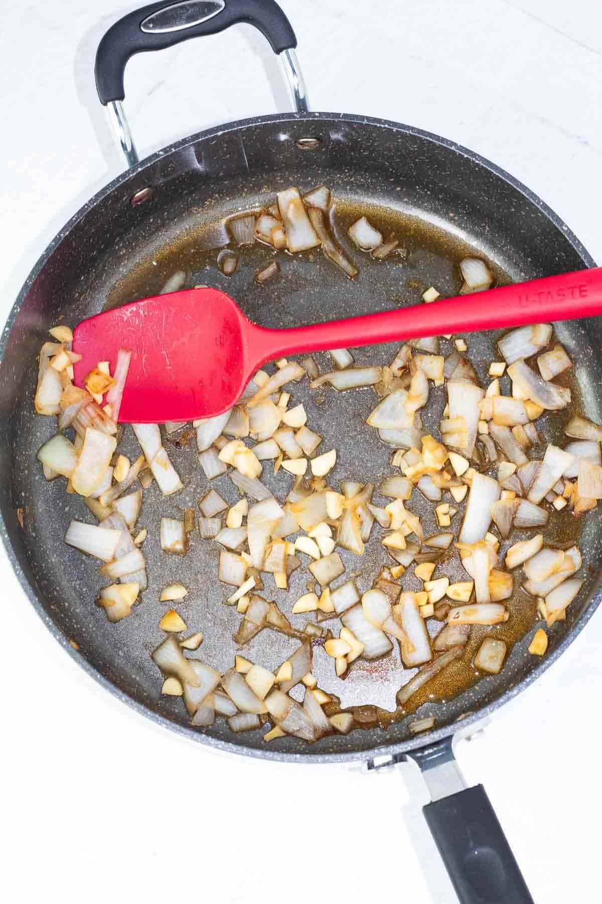 frying pan with onions and garlic browned.