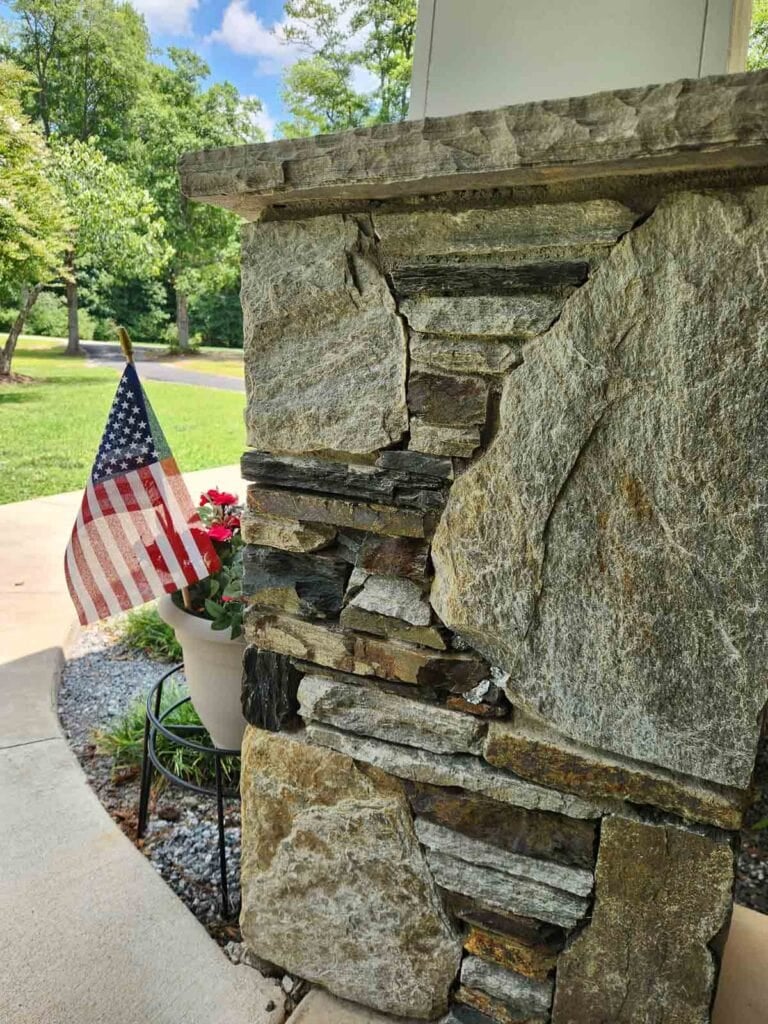 column on our porch with foil wad in wasp nest hole.