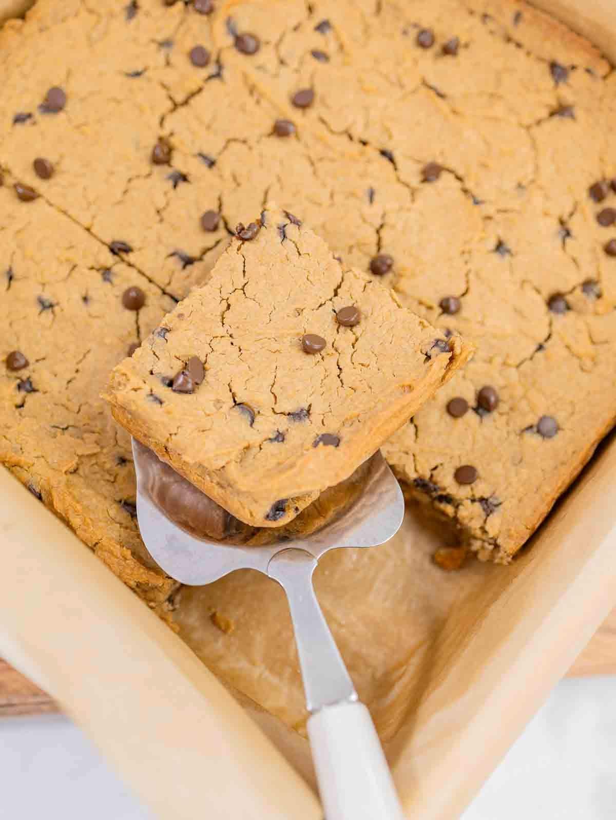 chickpea vegan blondies being sliced and served.
